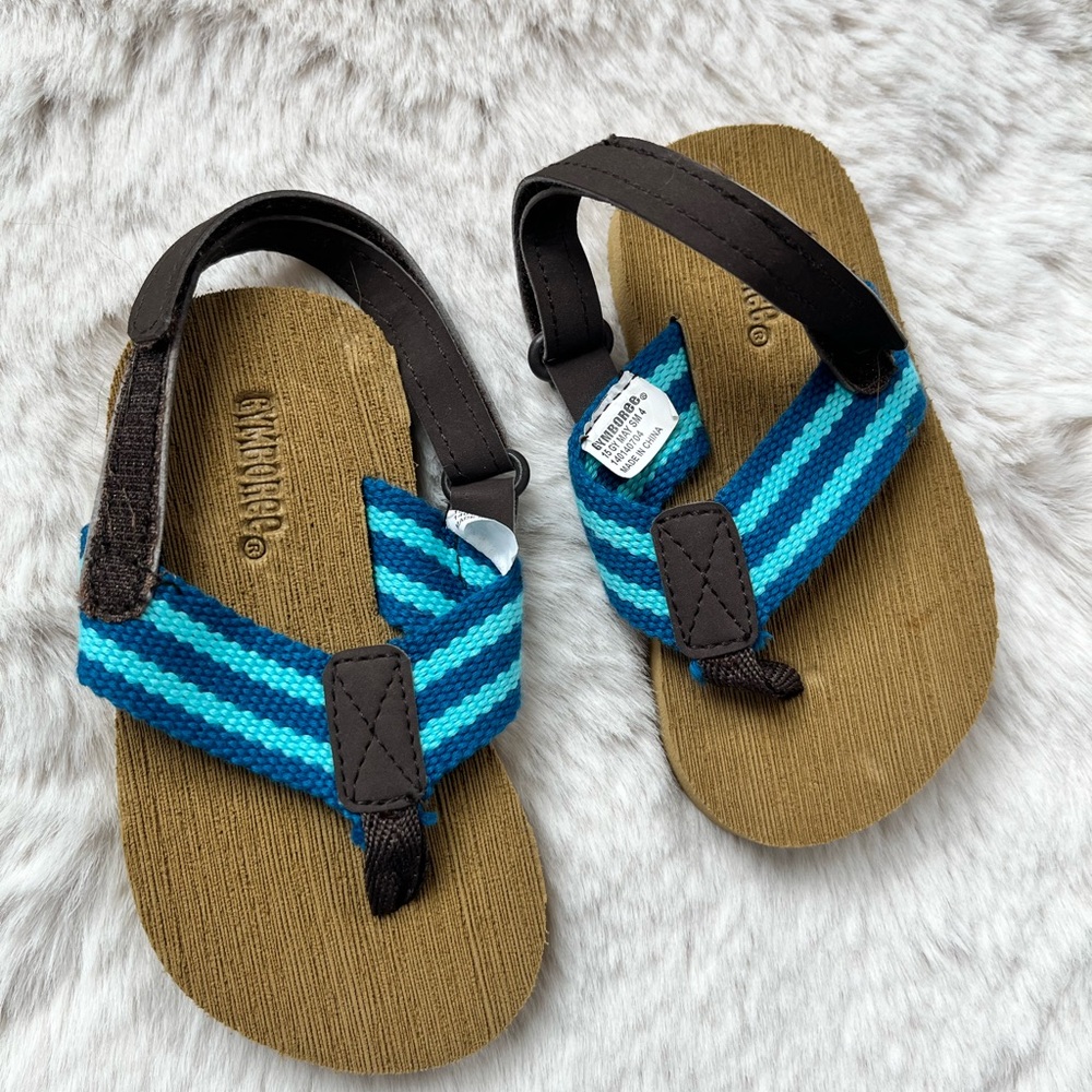 Gymboree.  Toddler 4 flip flops with back strap.  Look for complimentary post.